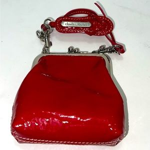 Beautiful one and only red mini wallet. Has a crocodile flaut texture